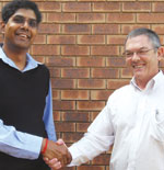 Outgoing president Johan Maartens welcomes incoming president Vinesh Maharaj.